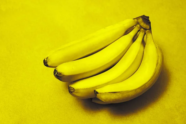 bananas on a yellow  background, close up