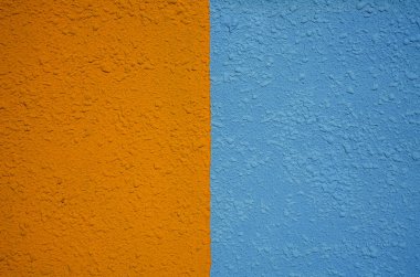 Turuncu ve mavi duvar dokusuarka plan. Sarı mavi duvar deseni arka plan. duvar arka plan. Soyut grunge arka plan. Bir fon veya doku olarak kullanılabilir.