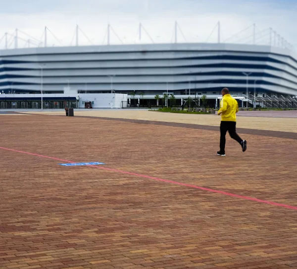 athletes sport man running on track on stadium background .Concept of people exercise activity.