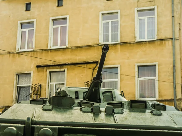 war, tank gun on  windows of house background.