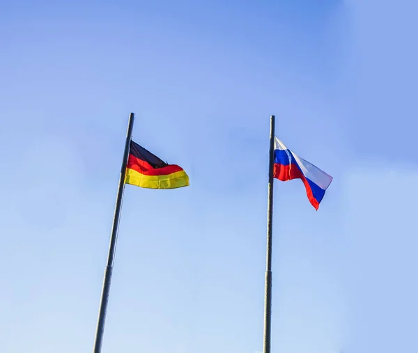 Russia Germany Flag Waving Wind Blue Sky Together Diplomacy Concept — Stock Photo, Image