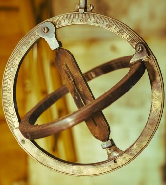 replica of a medieval astrolabe which is a navigation instrument capable of 43 different astronomical calculations clipart