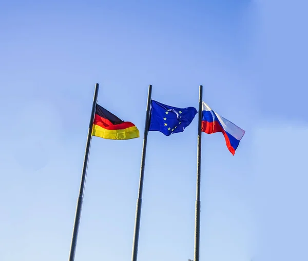 Flags Three Countries Germany Russia European Union Blue Sky Background — Stock Photo, Image