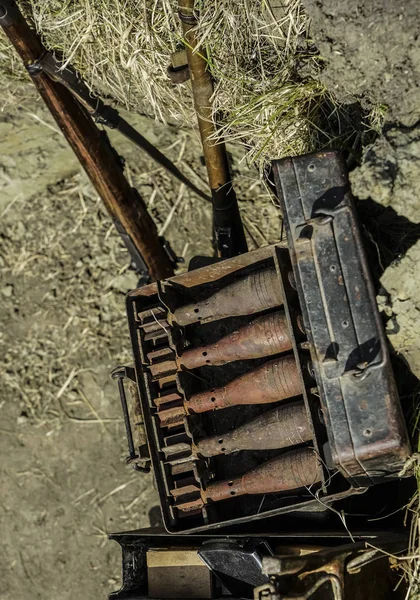 Rusty mortar shells in the metal box. mortar mine and a hand grenade launcher at the stand. Weapons of war in Ukraine