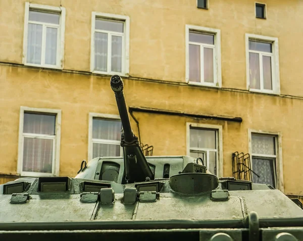 war, tank gun on  windows of house background.