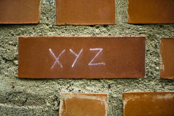 Xyz Inscription Painted Red Brick Wall Background Design Project Management — Stock Photo, Image