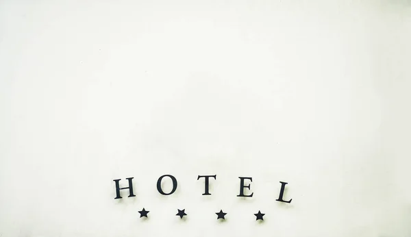 Sign luxury hotel detail hotel four stars luxury and elegance. 4 large metal stars and the word hotel