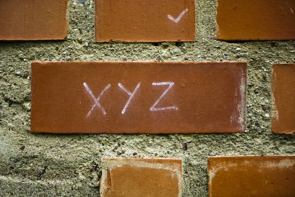 Xyz Inscription Painted Red Brick Wall Background Design Project Management — Stock Photo, Image