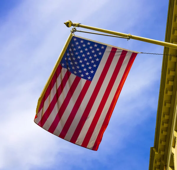 American flag hanging on a building in Alexandria, Virginia.