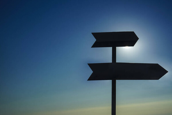 Two blank road signs on sky background