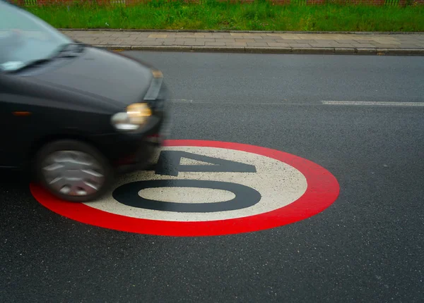 40 speed limit. drive your car in this area with a speed of only 40 km. Speed limit wrote in the asphalt — Stock Image Speed Limit Drive Your Car Area Speed Only Speed Limit Royalty Free Stock Images