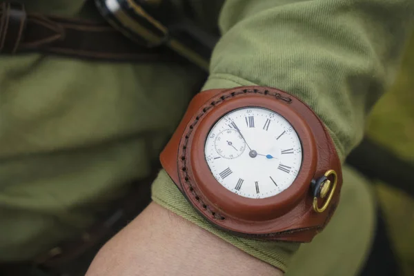 Retro men wrist watch on hand.Old men wrist watch with brown leather watch strap