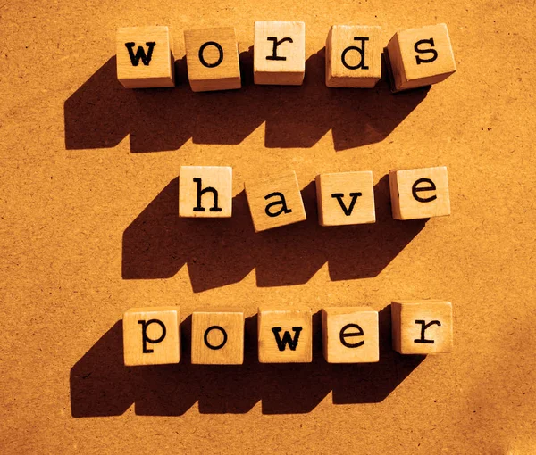 words  Words Have Power written in  wooden alphabet letters isolated on an craft paper