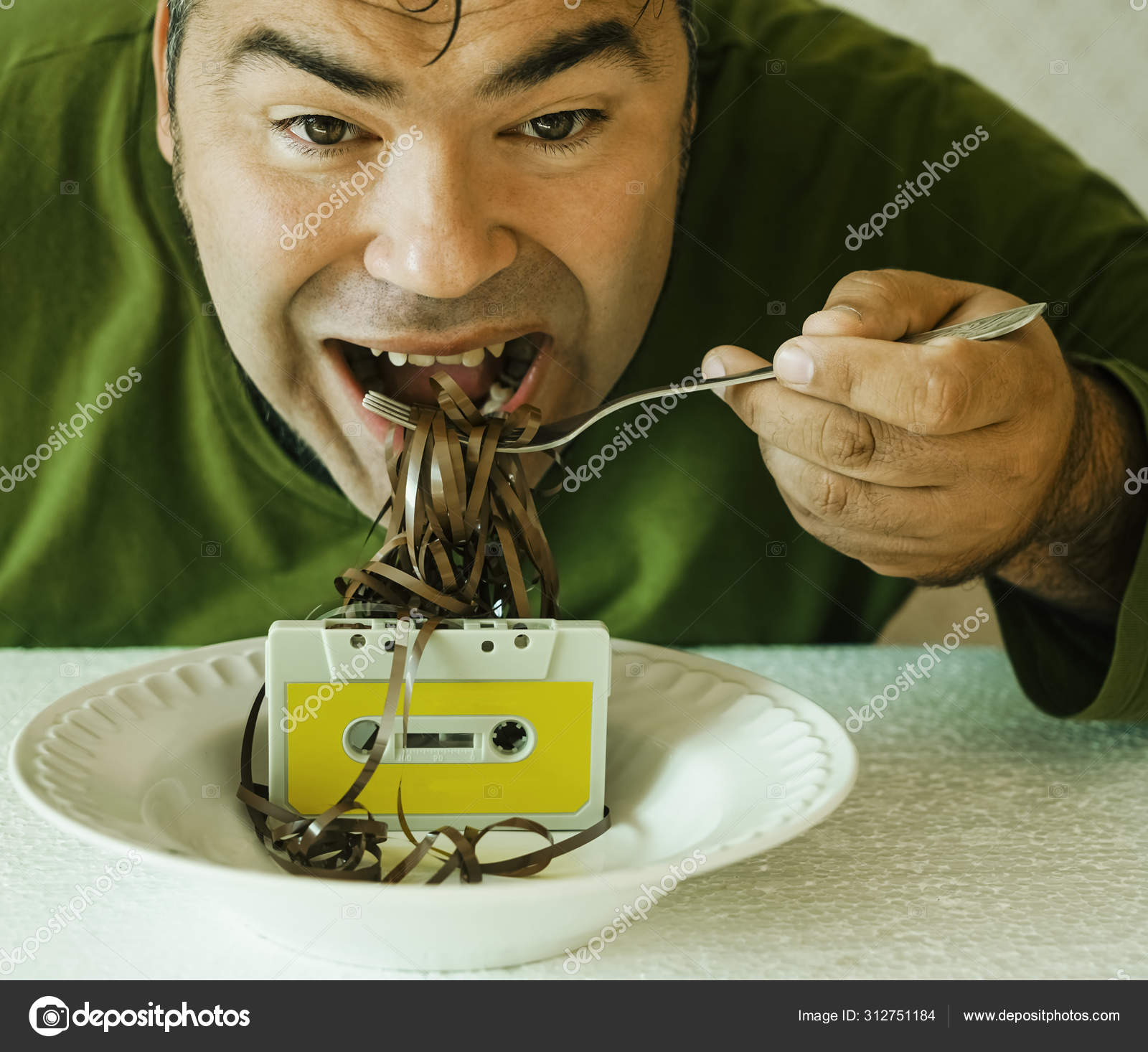 Man Eat Unspooled Cassette Tape Plate Metal Fork Eating Cassette Stock