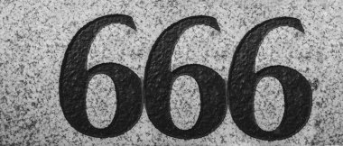 Engraved number 666 on stone background. black digit, number - three six.  clipart