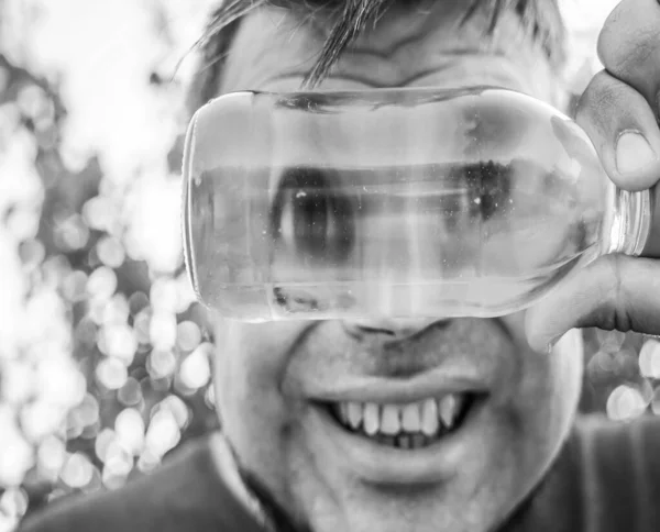 Handsome Smiling Young Man Glasses Disposable Water Bottle Looking Funny — ストック写真