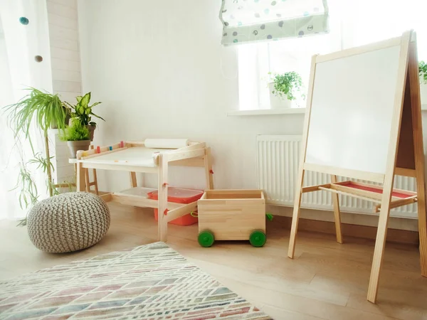 Kindergarten room with stool  and table for painting. children\'s room and furniture