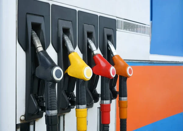 Gas station. Refueling pistols close-up. Fuel cost. Diesel and gas prices. Fuel pumps at a gas station