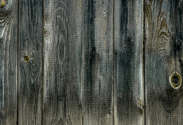 Old vintage outdoor wood with rusted screw texture in vertical line flooring background. Old gray wooden planks background.