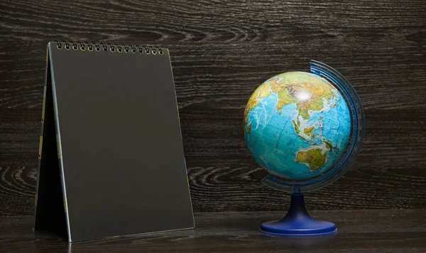 Top View Blank Notebook Black Paper Globe World Map Blue — Fotografia de Stock