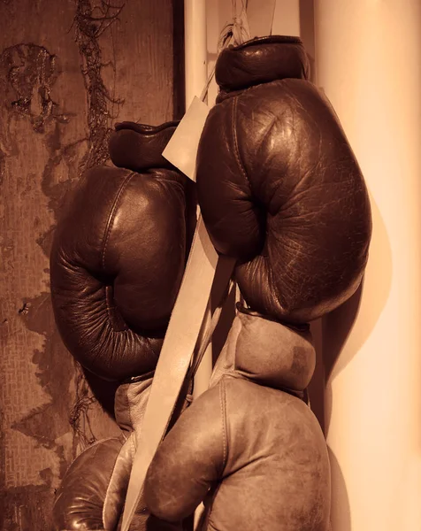 Pair Brown Leather Boxing Gloves Hang Wooden Wall Sports Equipment — Stock Photo, Image