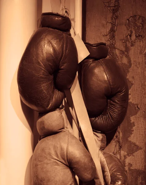 Pair Brown Leather Boxing Gloves Hang Wooden Wall Sports Equipment — Stock Photo, Image