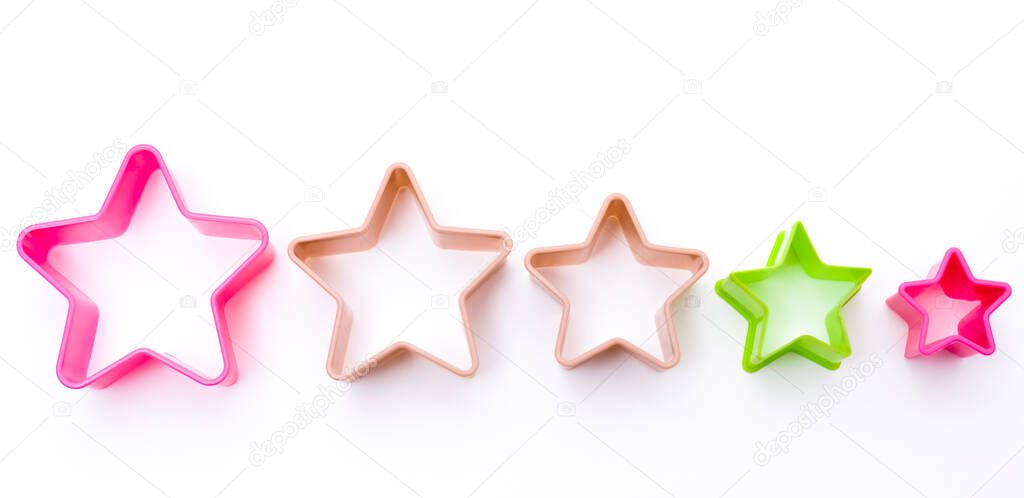 plastic form for cooking, five colorful stars shapes. isolated on white background