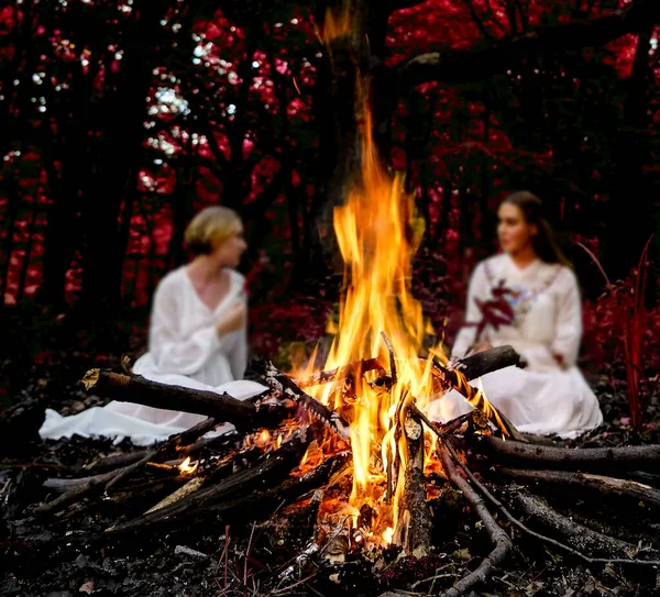 Focus Flame Two Witches Sitting Fire Evening Forest — Stock Photo, Image