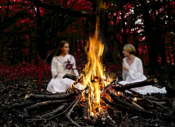 Focus Flame Two Witches Sitting Fire Evening Forest — Stock Photo, Image