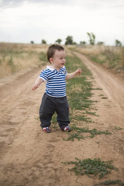 Babys first steps in nature. The first independent steps.