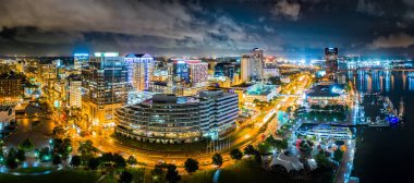 Aerial panorama of Norfolk, Virginia by night clipart
