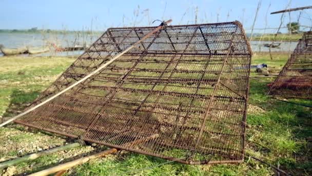 Panning Shot Rusty Clam Traps Laid Riverbank — Stock Video