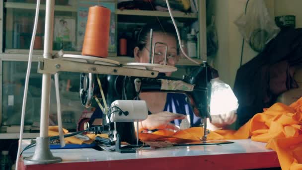 Woman Making Orange Robe Monk Using Sewing Machine — Stock Video