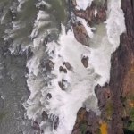 Overhead drone shot of over series of cascading waterfalls and rapids in the Mekong River