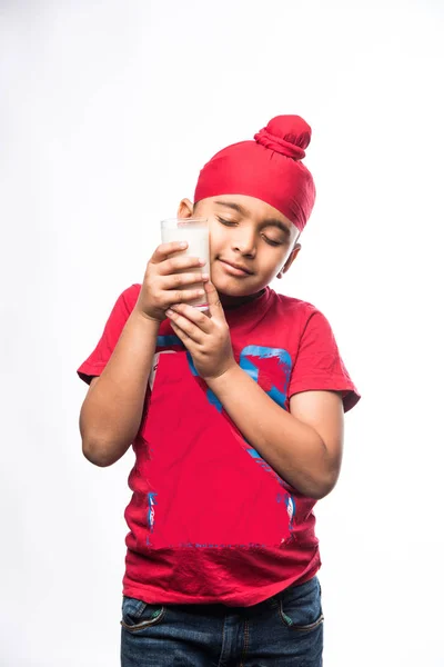 Indian Sikh Punjabi Small Boy Holding Glass Full Milk Isolated — Stock Photo, Image
