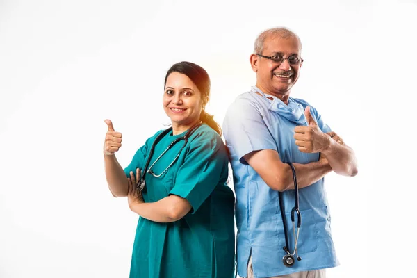 two Indian surgeons or doctors male and female standing isolated over white background