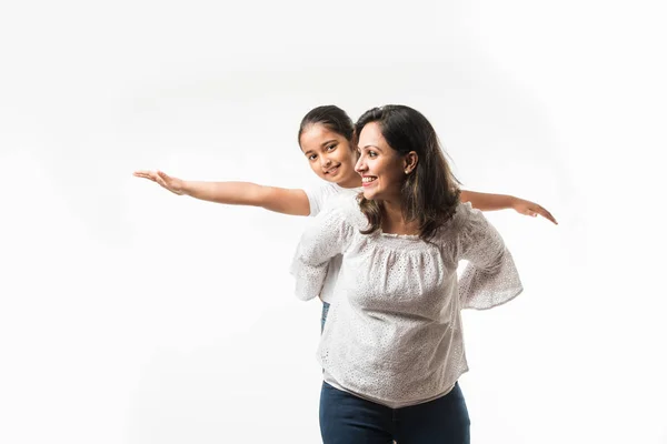 Indian Mother Daughter White Background Hugging Kissing Riding Flying Pointing — Stock Photo, Image