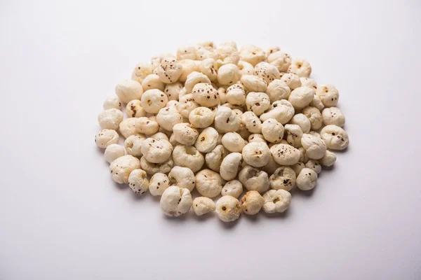 Makhana, also called as Lotus Seeds or Fox Nuts are popular dry snacks from India, served in a bowl. selective focus