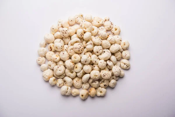 Makhana, also called as Lotus Seeds or Fox Nuts are popular dry snacks from India, served in a bowl. selective focus