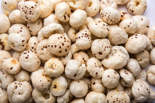 Makhana, also called as Lotus Seeds or Fox Nuts are popular dry snacks from India, served in a bowl. selective focus