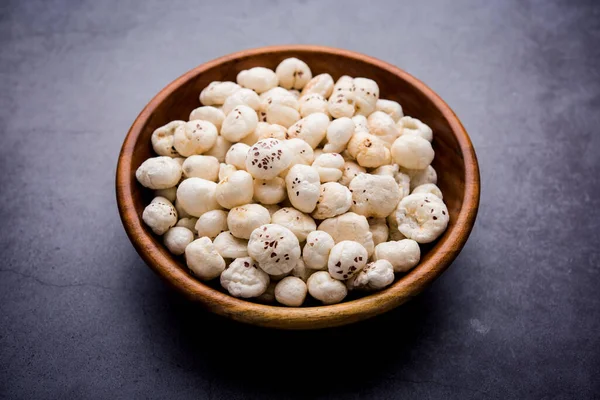 Makhana, also called as Lotus Seeds or Fox Nuts are popular dry snacks from India, served in a bowl. selective focus