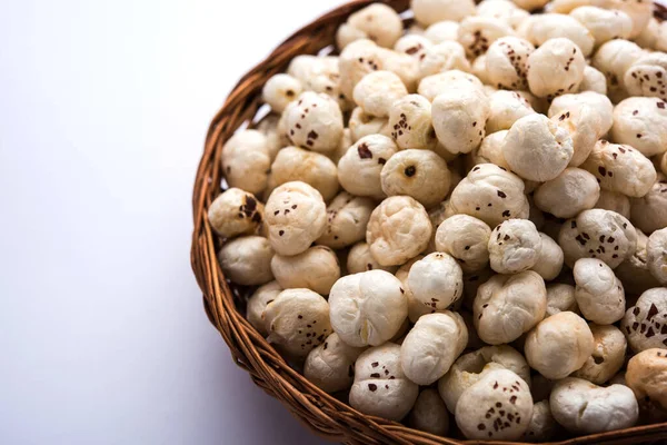 Makhana, also called as Lotus Seeds or Fox Nuts are popular dry snacks from India, served in a bowl. selective focus