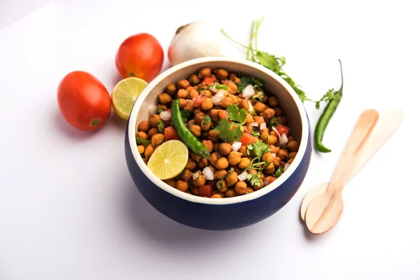 Black Chickpea Chaat or Kala Chana Chat recipe is a popular snack recipe from India, served in a bowl. selective focus