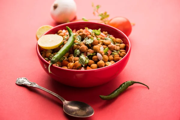 Black Chickpea Chaat or Kala Chana Chat recipe is a popular snack recipe from India, served in a bowl. selective focus