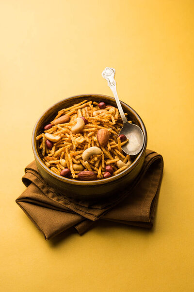 Aloo Chivda or Potato Chiwda also known as Falahari Namkeen for Vrat. Traditional Fasting snack recipe from India, garnished with Cashew Nuts and Almonds