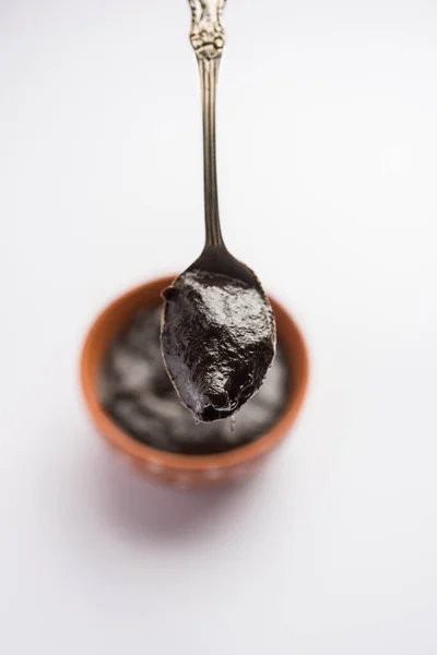 Chyawanprash or Chyavanprash is an Indian Ayurvedic Immunity booster health supplement made up of a concentrated blend of minerals and nutrient-rich herbs, served in a bowl, isolated