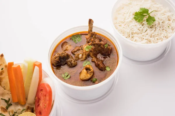Online Food Delivery - Mutton OR Gosht Masala OR indian lamb rogan josh in a plastic containar ready for pickup