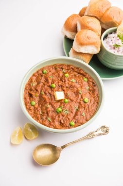 Mumbai Style Pav bhaji is a fast food dish from India, consists of a thick vegetable curry served with a soft bread roll, served in a plate clipart