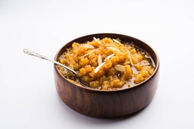 Moong dal halwa is a classic Indian sweet dish made with moong lentils, sugar, ghee and cardamom powder clipart