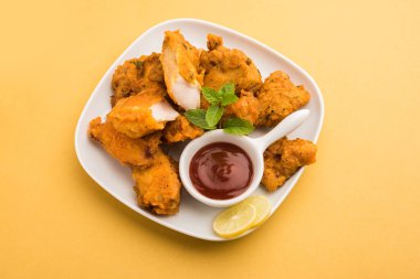 Chicken Pakora or pakoda or fritters is a popular Indian snack in which boneless chicken pieces are marinated and then coated with a mixture of besan, rice flour, cornflour, and egg clipart